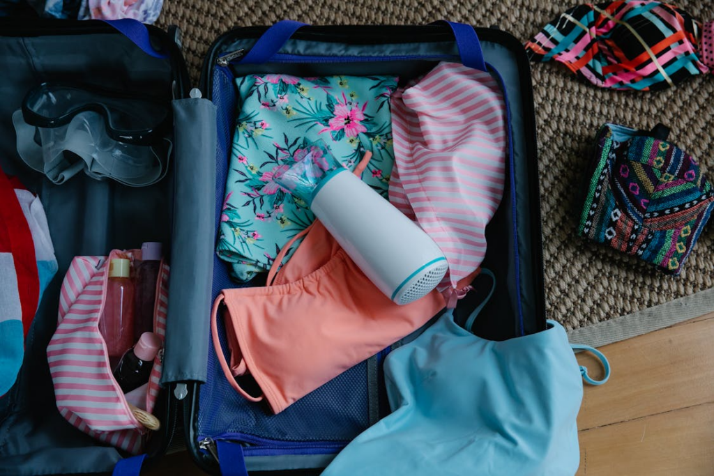 Clothes and Goggles inside a Suitcase