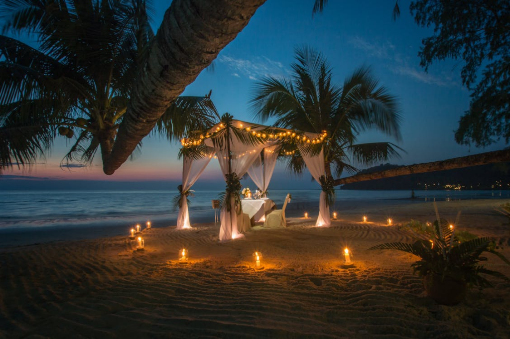 White Canopy Tent Near Coastline - Candlelight Dinner