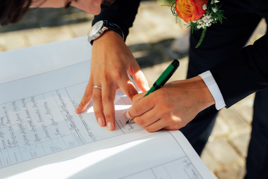 A Groom Signing a Document