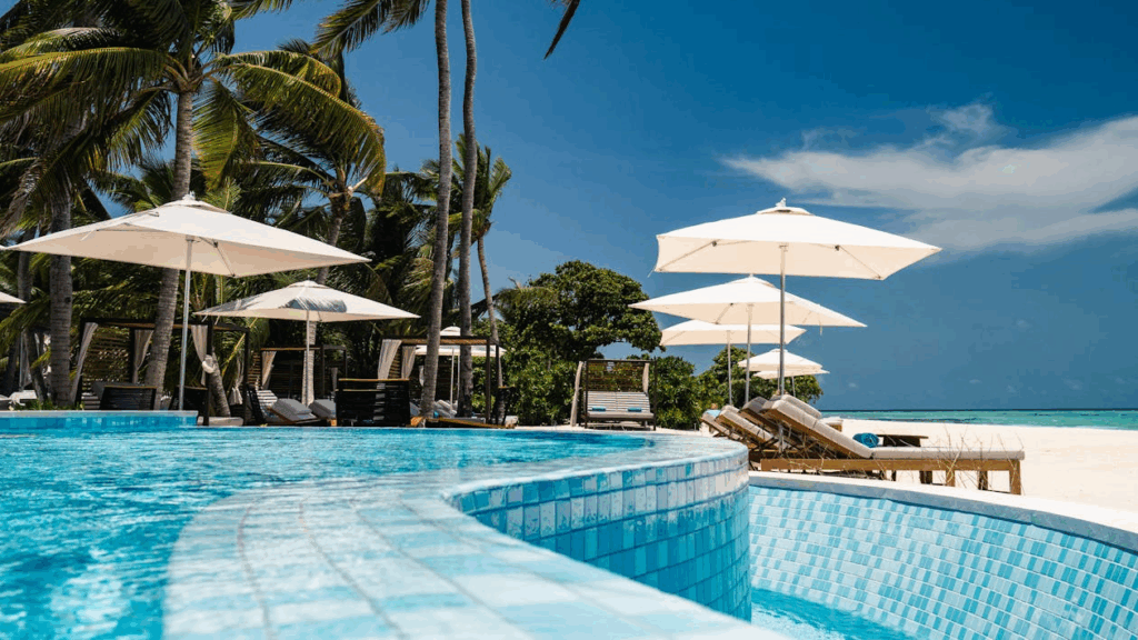 White Outdoor Umbrellas Near Swimming Pool