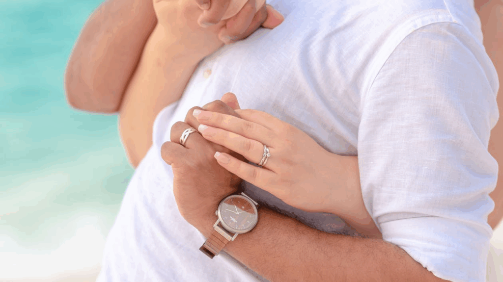 A Couple Holding Each Others Hand