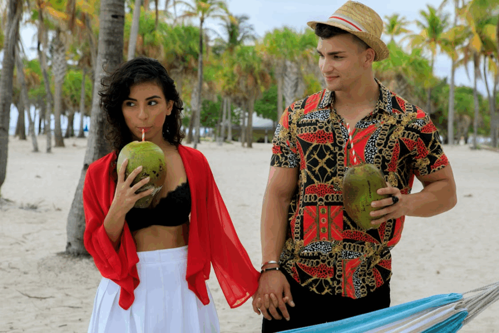 Man And Woman Drinking Fresh Coconut Juice