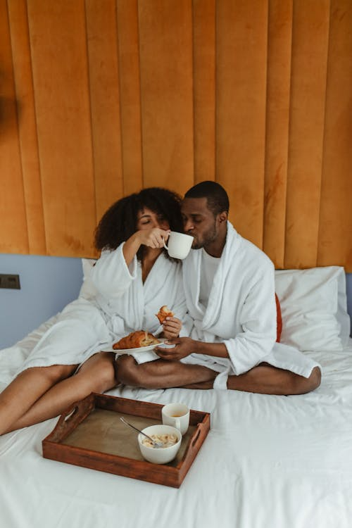 Man and a Woman Having Breakfast in Bed