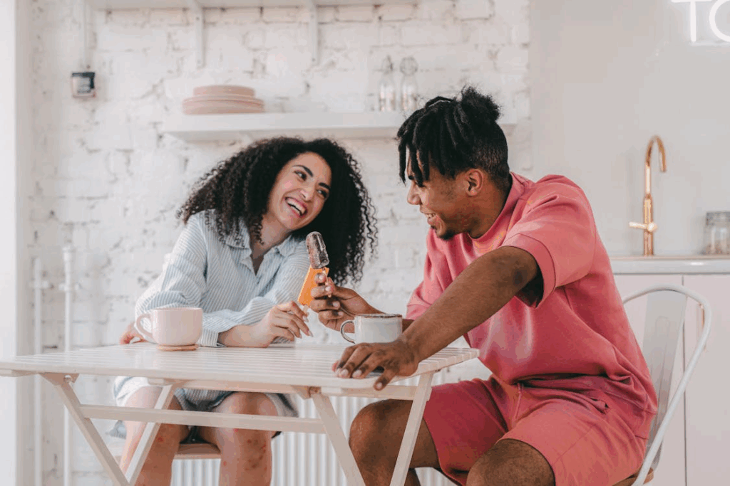 Sweet Couple Eating Ice Cream Bar Together