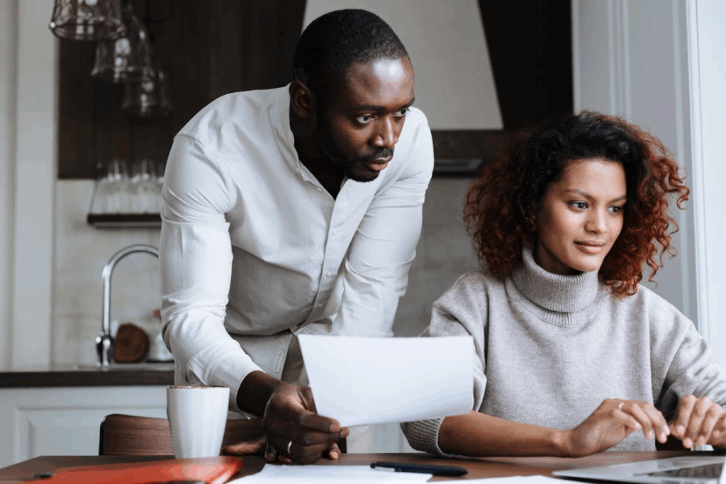 Couple Working at Home in Kitchen